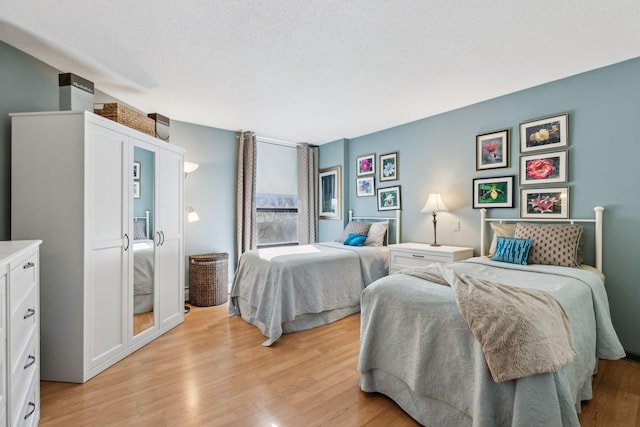 6615 Lake Shore Dr S Unit 403, Richfield, MN 55423 - bedroom with light wood-style floors