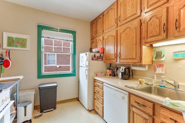 kitchen with sink and white appliances