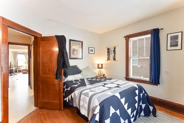 bedroom with light hardwood / wood-style flooring