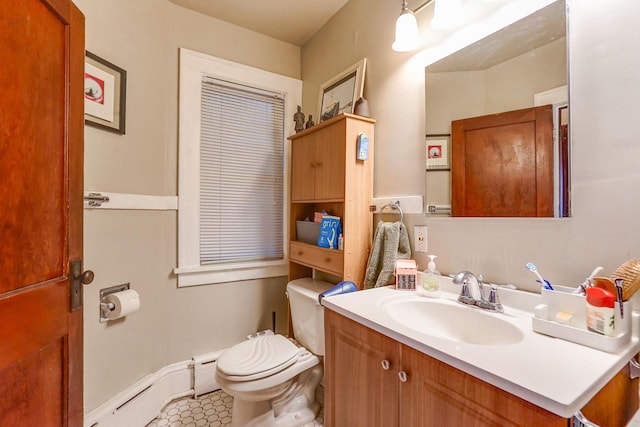 bathroom with tile patterned flooring, a baseboard radiator, vanity, and toilet