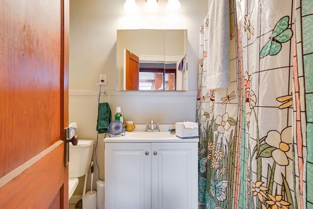 bathroom with vanity and toilet