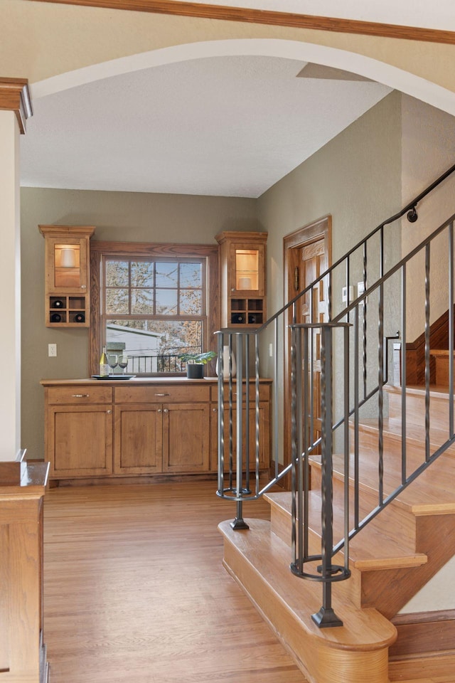 stairs with wood finished floors