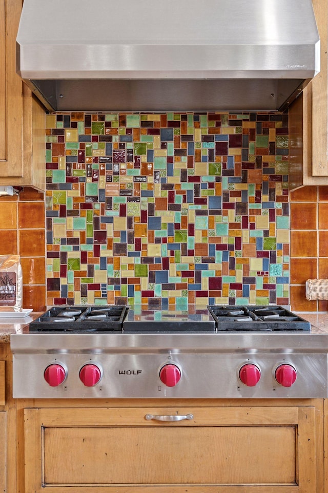 details with decorative backsplash and extractor fan