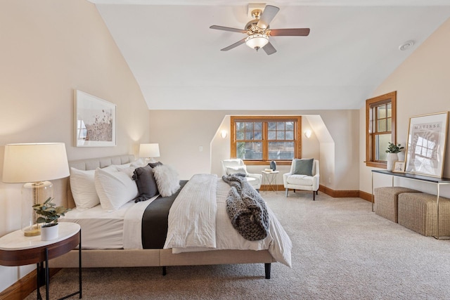 bedroom with baseboards, carpet floors, lofted ceiling, and a ceiling fan