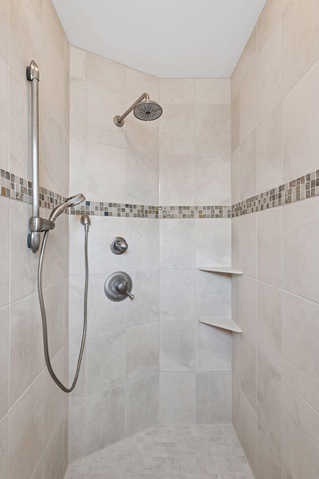 bathroom with tiled shower