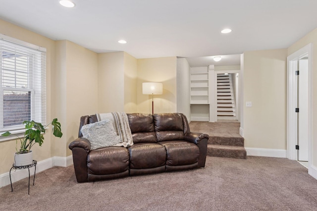 living room featuring recessed lighting, stairway, baseboards, and carpet flooring