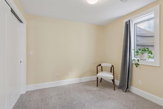 unfurnished room featuring baseboards and carpet