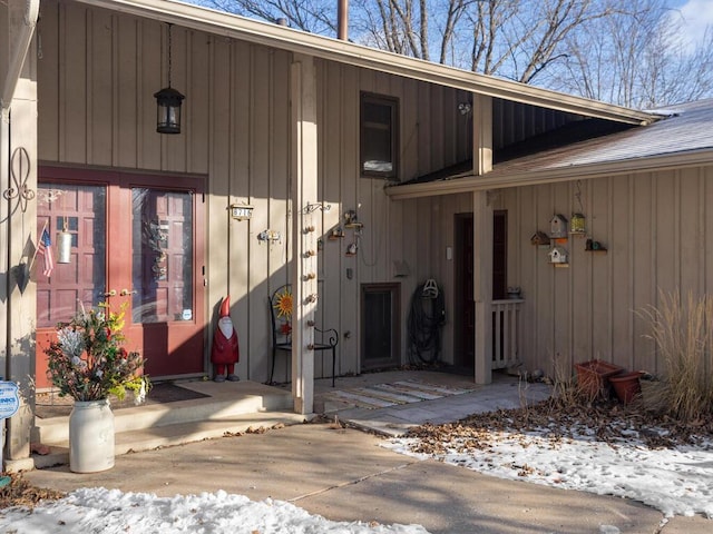 view of snow covered property entrance