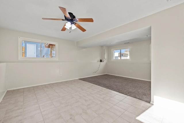 carpeted empty room with ceiling fan