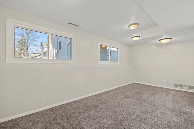 empty room with carpet flooring