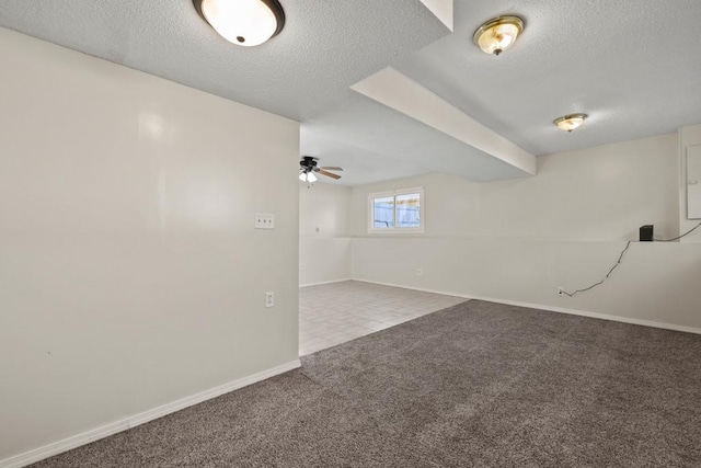 carpeted spare room featuring a textured ceiling