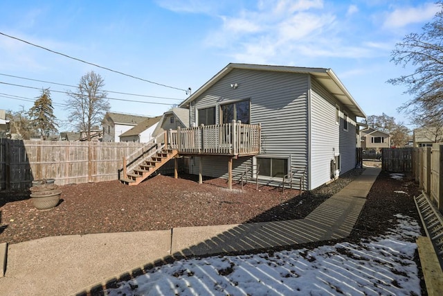 rear view of property featuring a deck