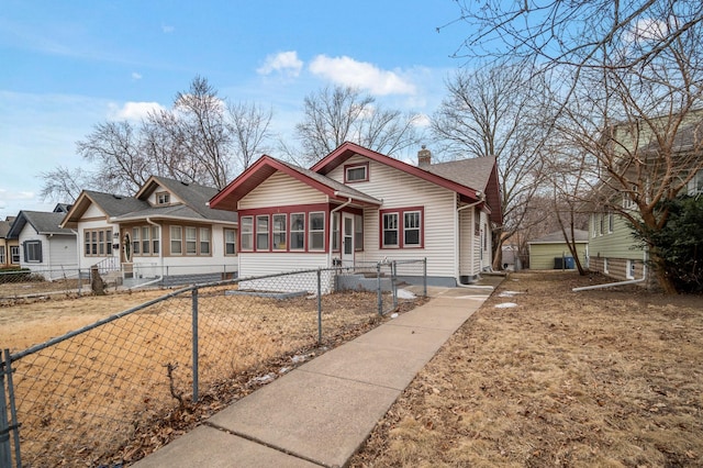 bungalow-style house featuring a sunroom