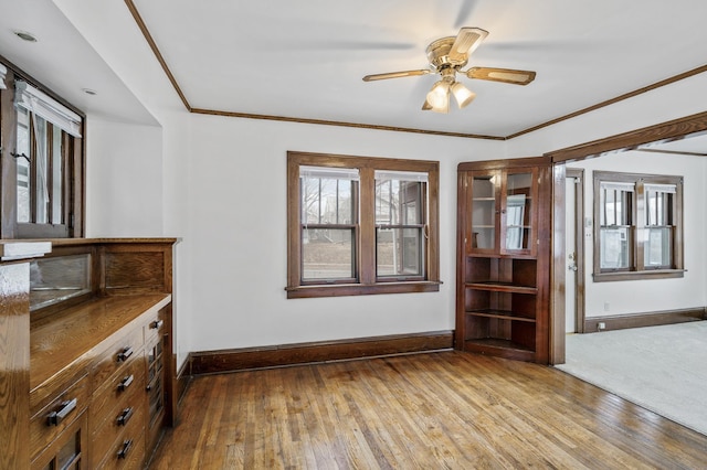 3431 Irving Ave N, Minneapolis, MN 55412 - unfurnished dining area featuring hardwood / wood-style flooring, ceiling fan, and crown molding