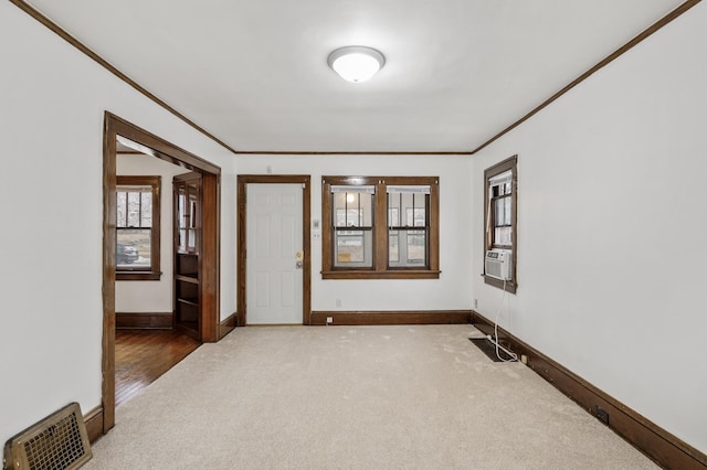 3431 Irving Ave N, Minneapolis, MN 55412 - carpeted empty room featuring crown molding and baseboards