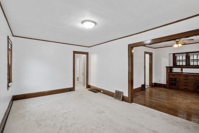 3431 Irving Ave N, Minneapolis, MN 55412 - carpeted empty room featuring ornamental molding and a ceiling fan