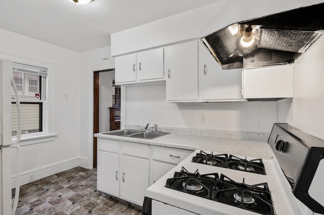 3431 Irving Ave N, Minneapolis, MN 55412 - kitchen featuring white appliances, white cabinetry, light countertops, and extractor fan
