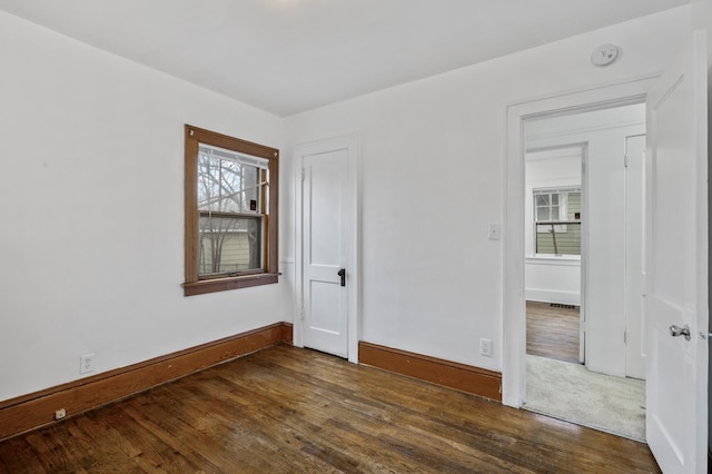 3431 Irving Ave N, Minneapolis, MN 55412 - unfurnished room featuring a smoke detector, dark wood finished floors, and plenty of natural light