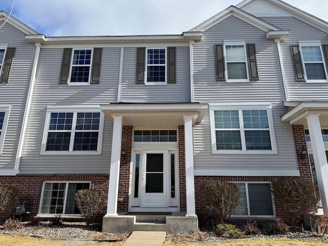 multi unit property featuring brick siding