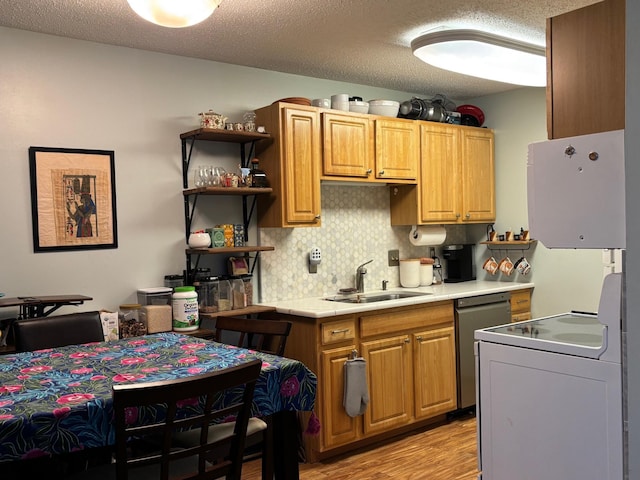 kitchen featuring sink, a textured ceiling, dishwasher, light hardwood / wood-style floors, and stove