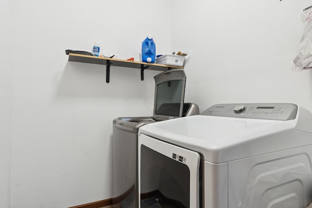 washroom featuring washing machine and dryer