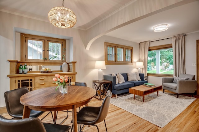 4415 Snelling Ave, Minneapolis, MN 55406 - dining space with light wood-type flooring, crown molding, and a chandelier