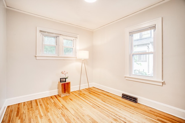 4415 Snelling Ave, Minneapolis, MN 55406 - unfurnished room featuring wood finished floors and crown molding