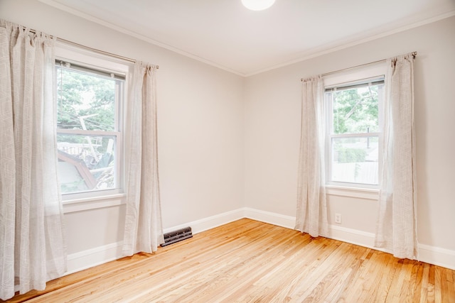 4415 Snelling Ave, Minneapolis, MN 55406 - unfurnished room with ornamental molding, wood finished floors, and plenty of natural light