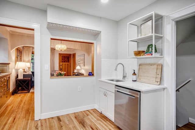 4415 Snelling Ave, Minneapolis, MN 55406 - bar area with dishwasher, light wood-style floors, backsplash, and arched walkways