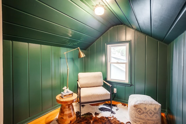 4415 Snelling Ave, Minneapolis, MN 55406 - living area with lofted ceiling, wood finished floors, and a decorative wall