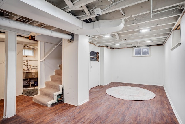 4415 Snelling Ave, Minneapolis, MN 55406 - basement with wood finished floors, stairway, and healthy amount of natural light