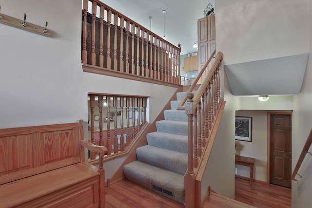 staircase featuring hardwood / wood-style floors