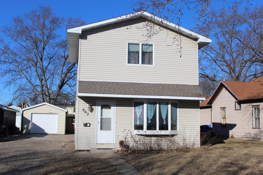 view of front of home featuring an outbuilding and a garage