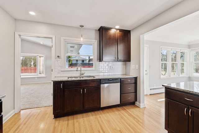 kitchen with a baseboard radiator, a sink, decorative backsplash, dark brown cabinets, and dishwasher