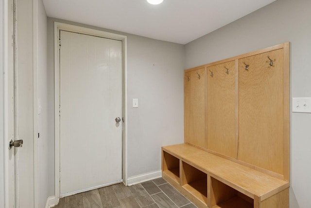 mudroom with baseboards and wood finished floors