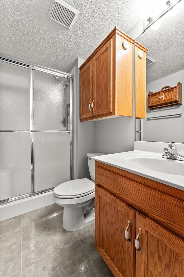 bathroom with vanity, toilet, and walk in shower