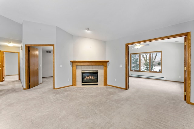 unfurnished living room featuring a baseboard radiator, light colored carpet, and a fireplace