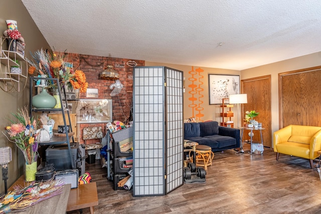 living room with hardwood / wood-style floors and a textured ceiling