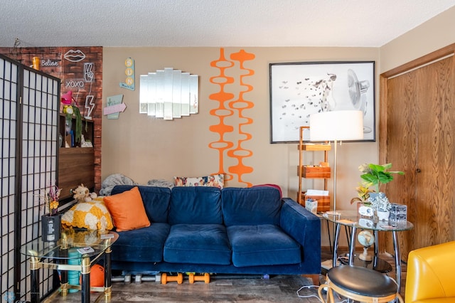 living room with hardwood / wood-style flooring and a textured ceiling