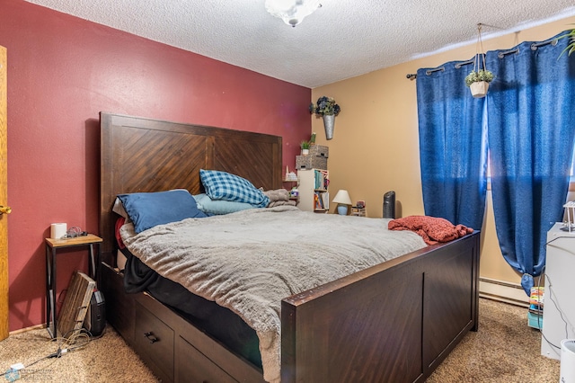 carpeted bedroom featuring a textured ceiling and a baseboard heating unit