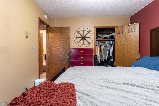 bedroom with a closet and a textured ceiling