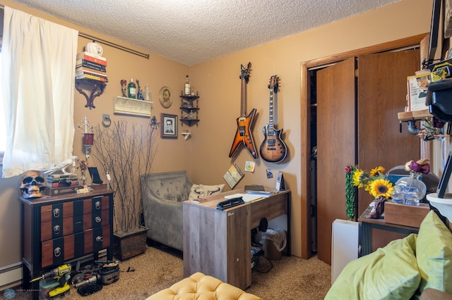 office space with light carpet, a baseboard heating unit, and a textured ceiling