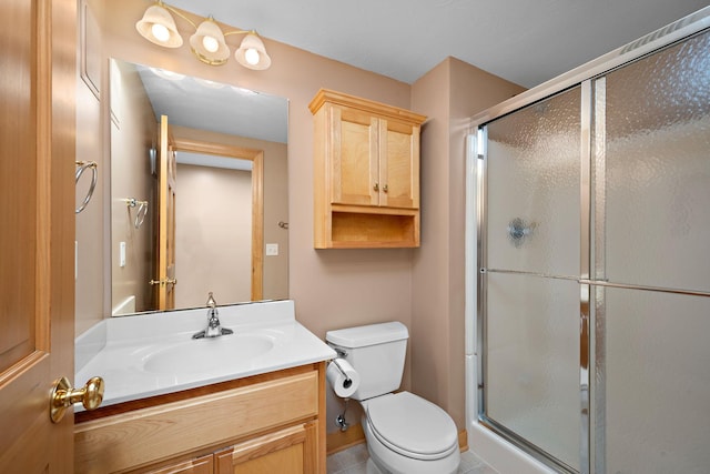 full bath with toilet, a shower stall, and vanity