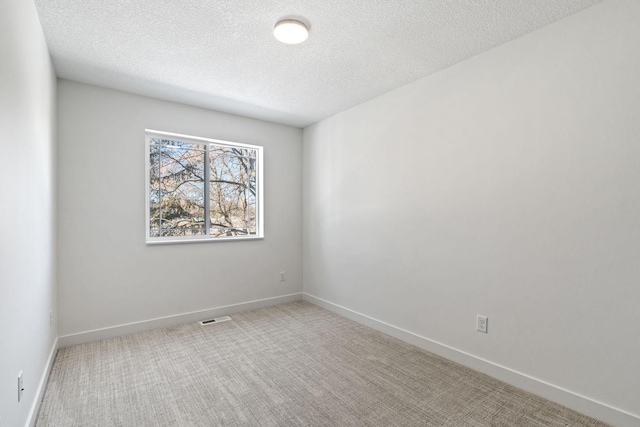 spare room featuring a textured ceiling