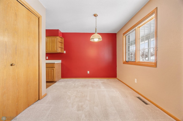 dining room featuring light carpet