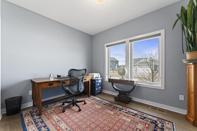 office with wood-type flooring