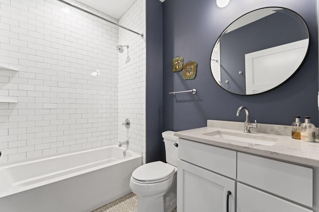 full bathroom with vanity, toilet, and tiled shower / bath