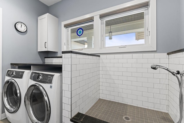 laundry area featuring cabinets and independent washer and dryer