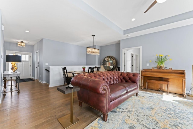 living room featuring dark hardwood / wood-style flooring and a notable chandelier