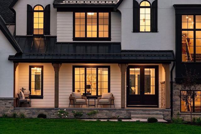 back of property featuring french doors